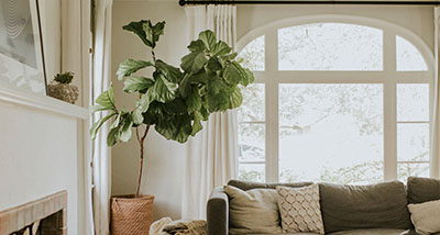 a cosy living room with a large window