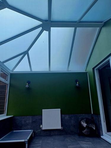 Overlooked by Nosey Neighbour, solved with Privacy window film. The cloudy day finished effect of privacy window film installed on a conservatory roof.